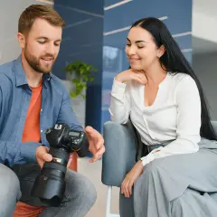 Mężczyzna z aparatem pokazuje kobiecie efekty swojej pracy. Fotograf omawia szczegóły sesji.
